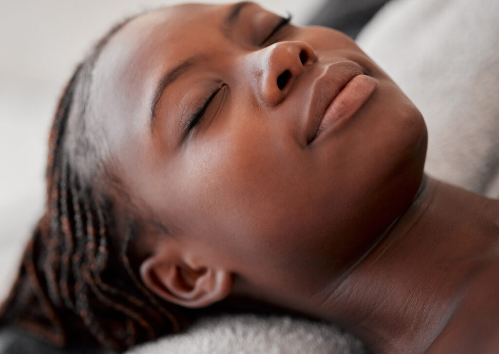 Esthetician applying a chemical peel to a client’s face at a Fayetteville skincare clinic, highlighting personalized care and expert treatment.