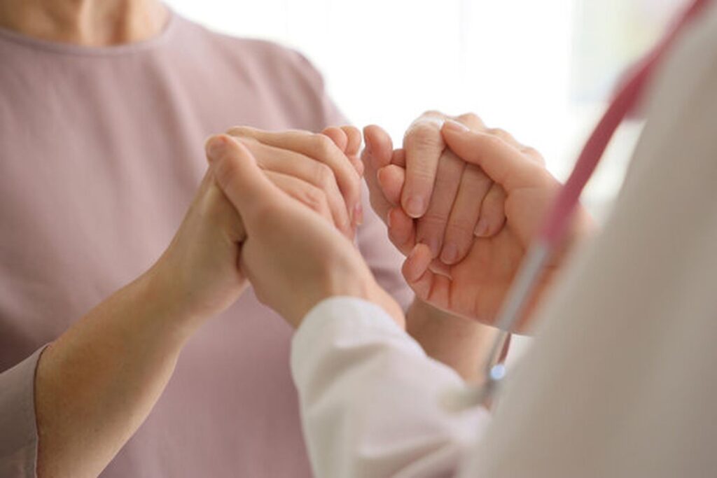 Mature woman with gynecologist during menopause treatment consultation at women's health clinic