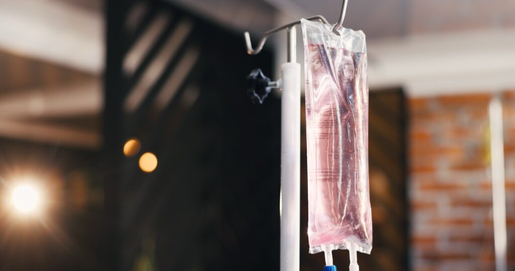 IV vitamin therapy drip bag hanging in a wellness clinic